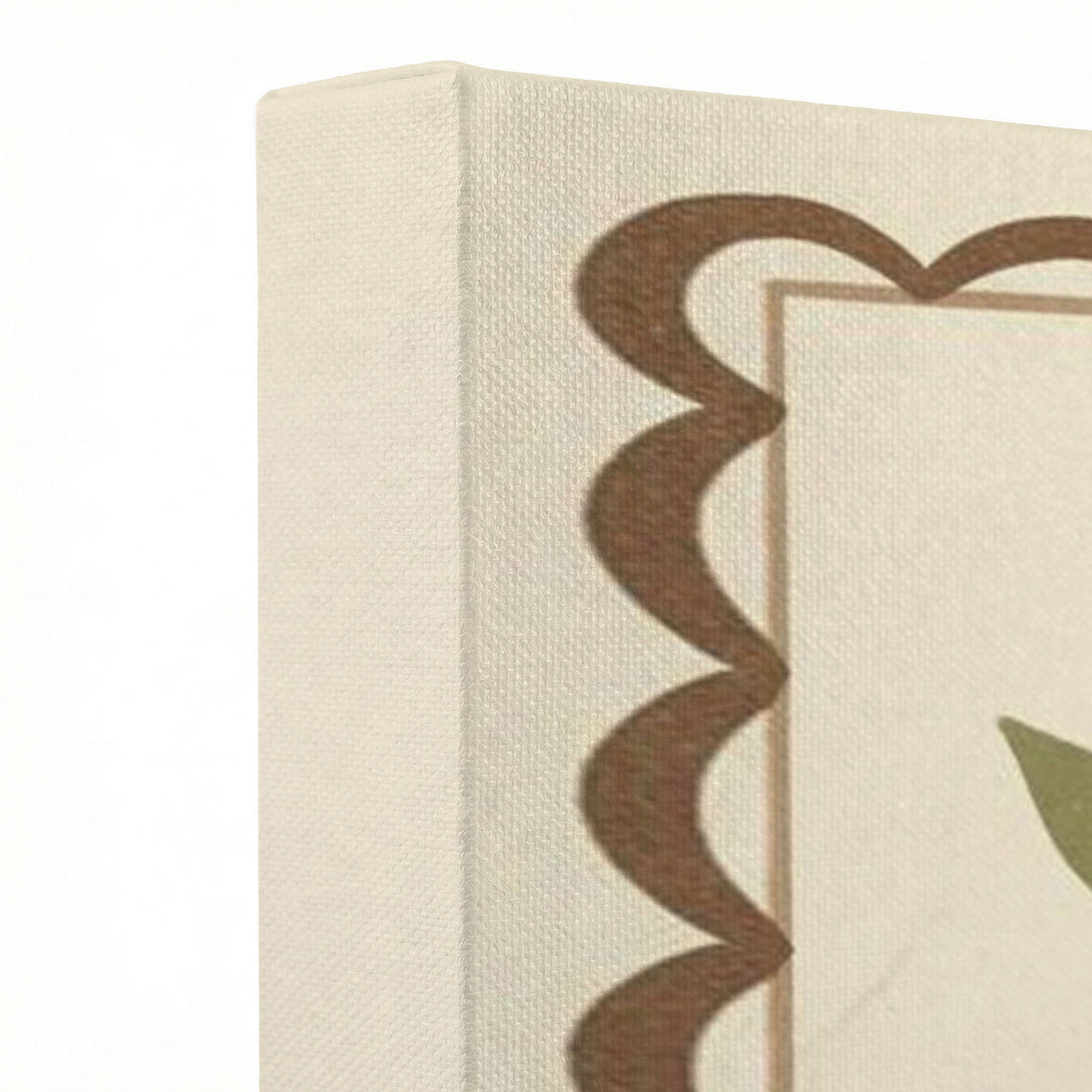 Close-up of gallery-wrapped canvas corner showing cream fabric texture and brown scalloped border detail