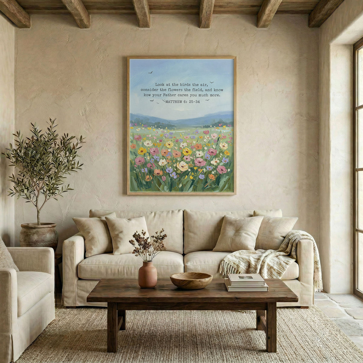 Large wildflower scripture canvas in wood frame above linen sofa in neutral living room