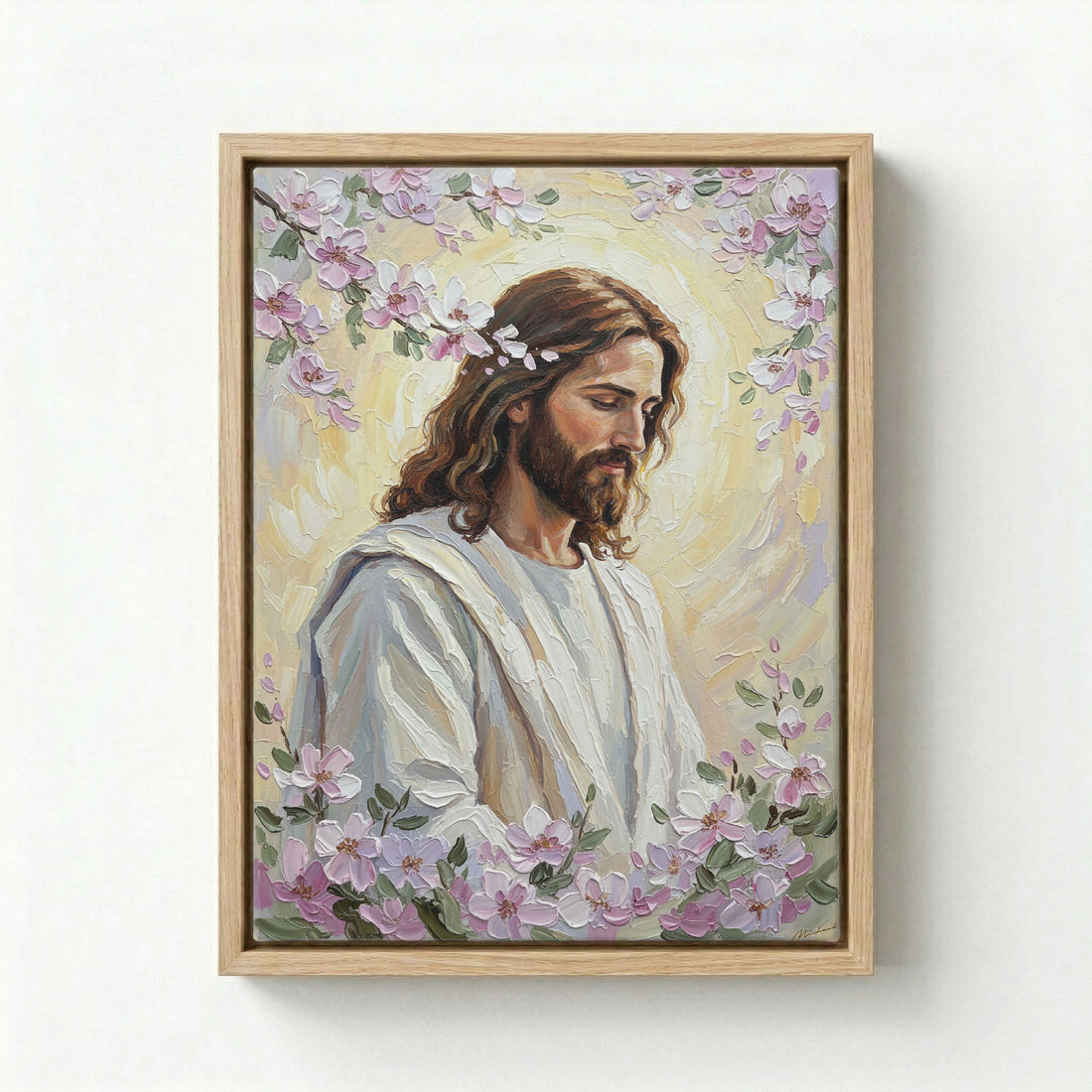 Black framed Jesus Christ portrait with pink cherry blossom halo on a light grey background.