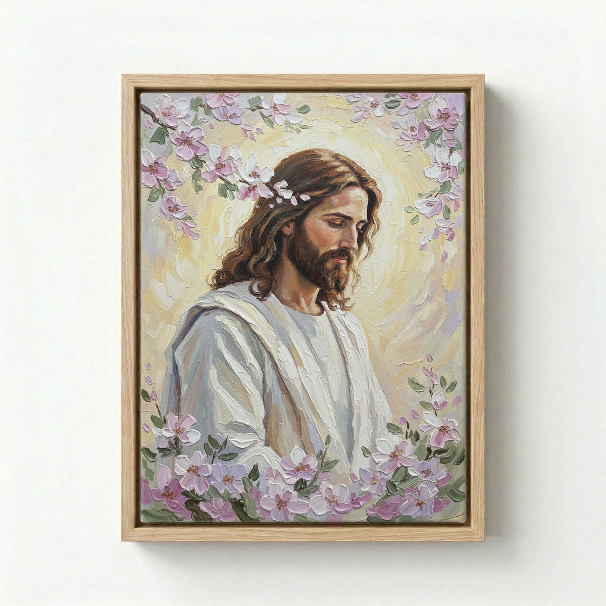 Black framed Jesus Christ portrait with pink cherry blossom halo on a light grey background.