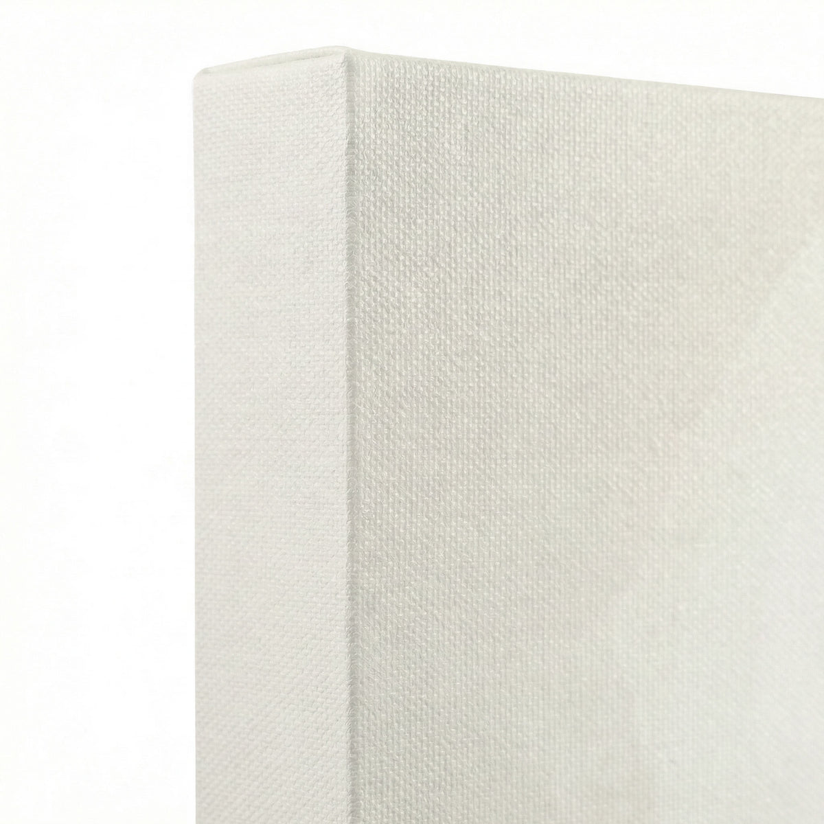 Close-up of canvas wrap edge showing premium white stretched canvas texture with clean cream surface
