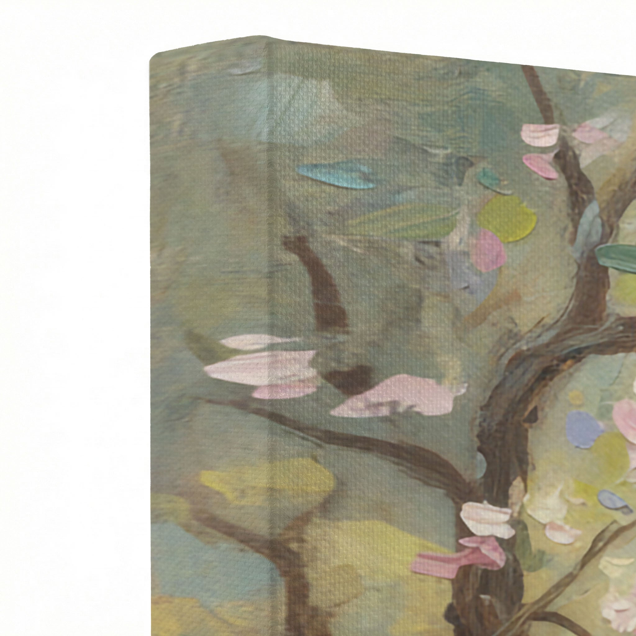 Close-up of canvas wrap edge showing oil painting texture with pink blossom branches and sage tones
