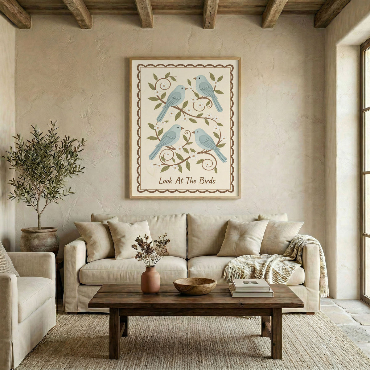 Cozy living room with Look At The Birds canvas wall art hung above a beige sofa, wood beam ceiling