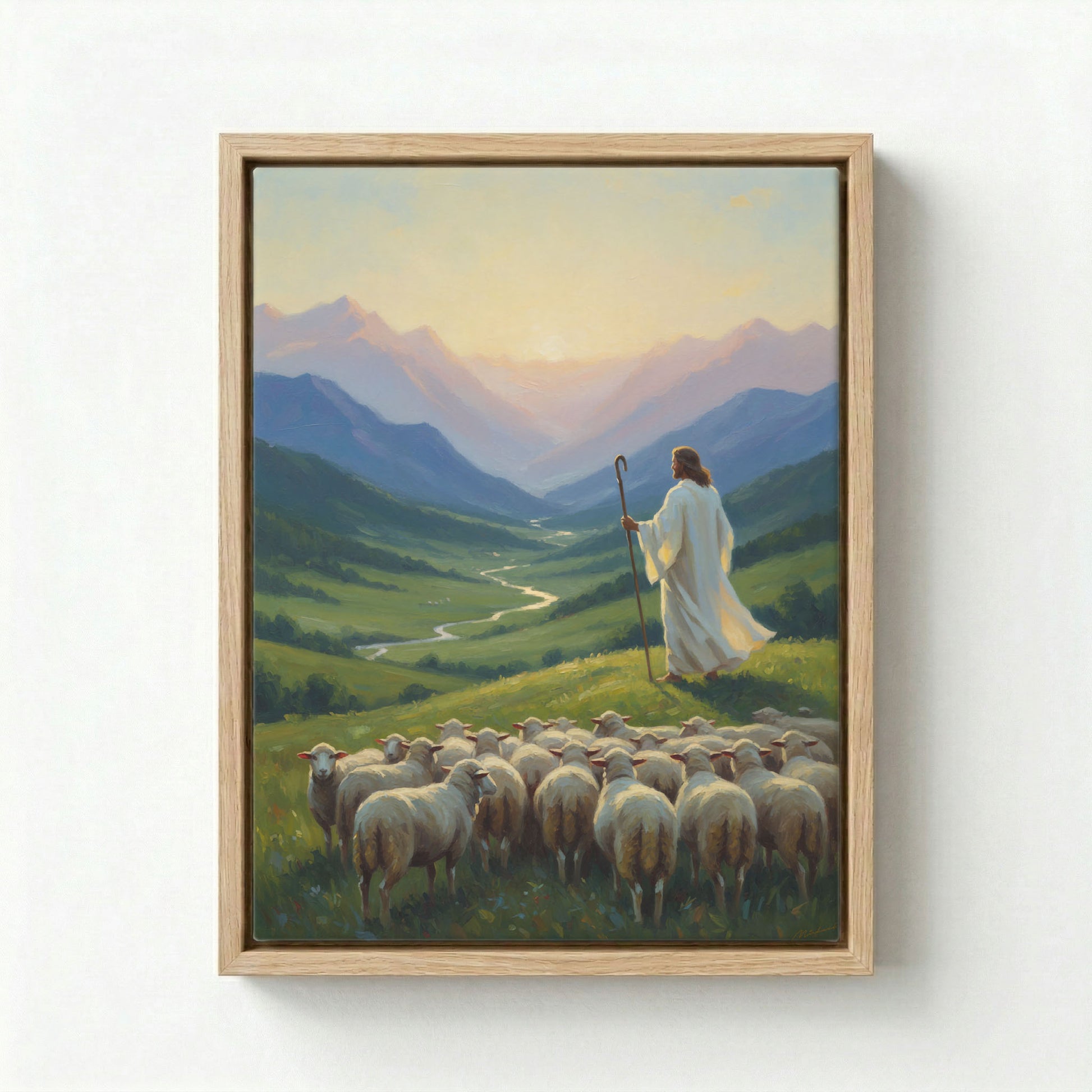 Canvas in natural wood floating frame with Jesus as Good Shepherd holding staff overlooking green valley at sunrise with flock