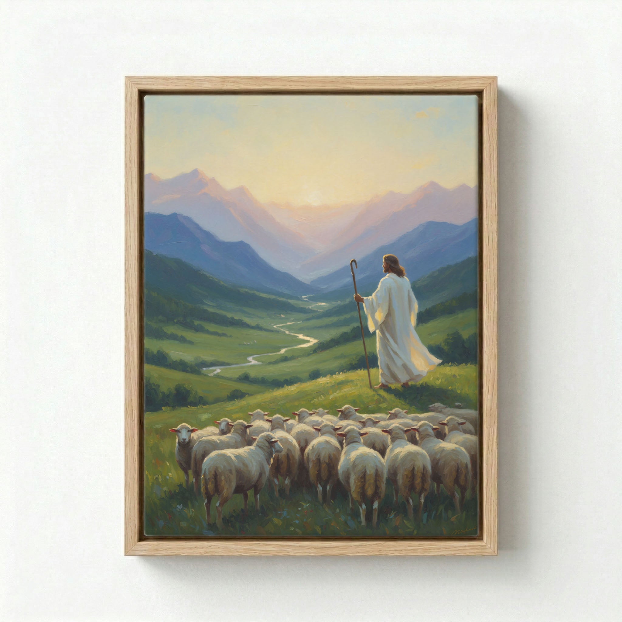 Canvas in natural wood floating frame with Jesus as Good Shepherd holding staff overlooking green valley at sunrise with flock