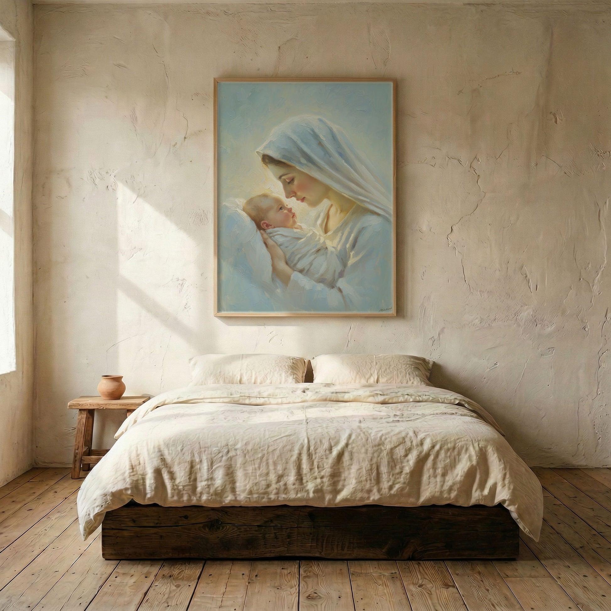 Virgin Mary holding Baby Jesus canvas print in wood frame mounted above linen platform bed in serene neutral bedroom