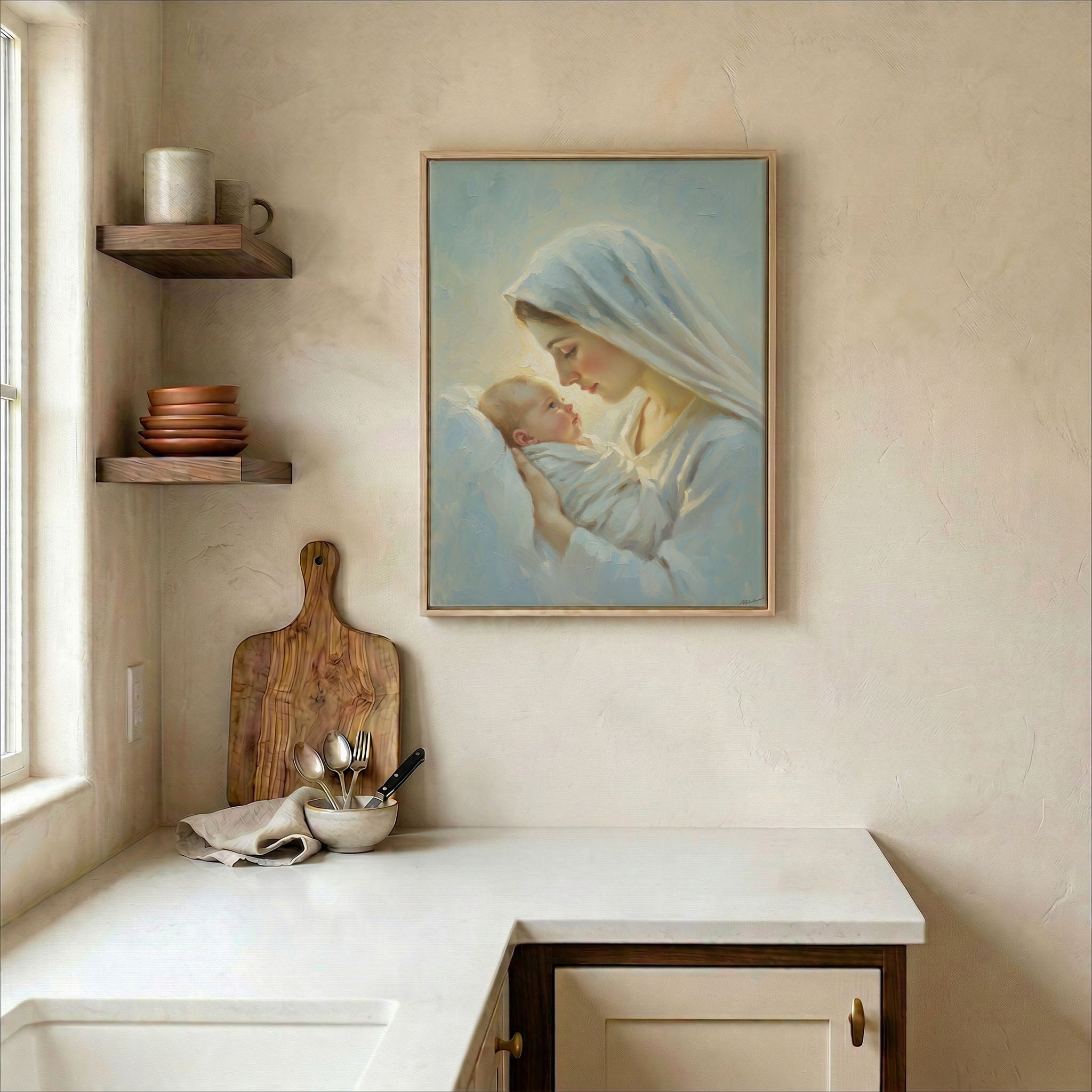 Virgin Mary and Baby Jesus oil painting print in wood frame on kitchen wall in warm neutral farmhouse setting