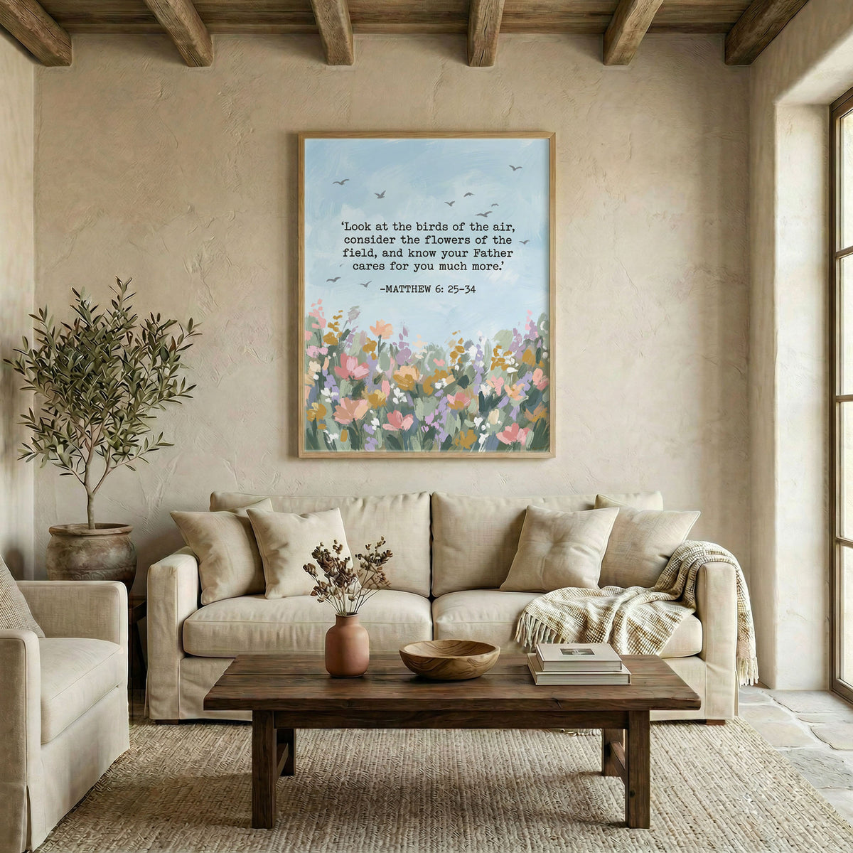 Large Matthew 6:25-34 Christian floral wall art in wood frame displayed above living room sofa in warm neutral space